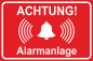 Mobile Preview: rotes Hinweisschild mit weißem Symbol und Text Achtung Alarmanlage